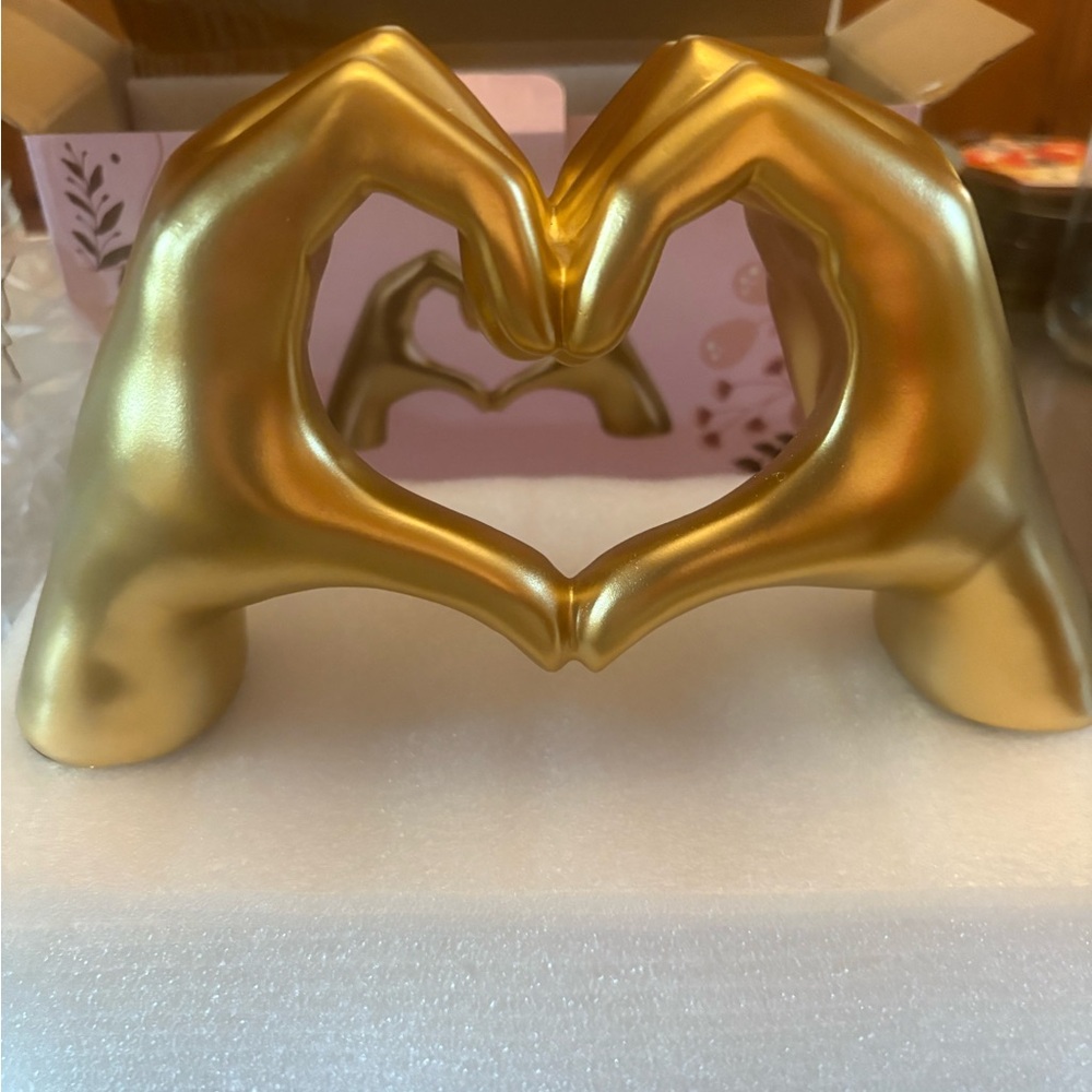 Gold Heart-Shaped Hand Sculpture